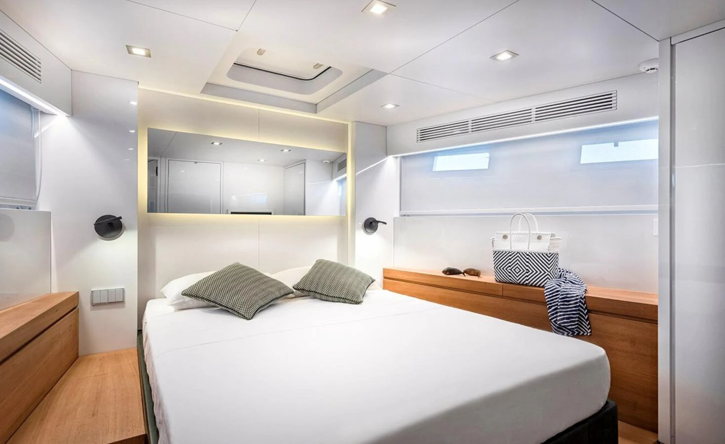 a room with a bed and a table aboard ATLASS Yacht for Sale