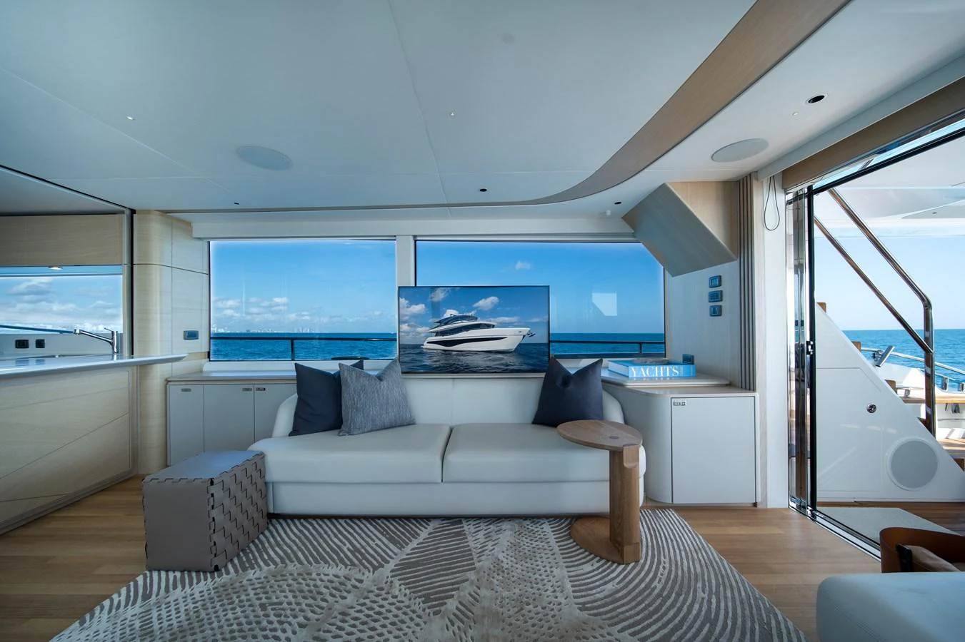 a living room with a large window aboard MARAVI Yacht for Sale