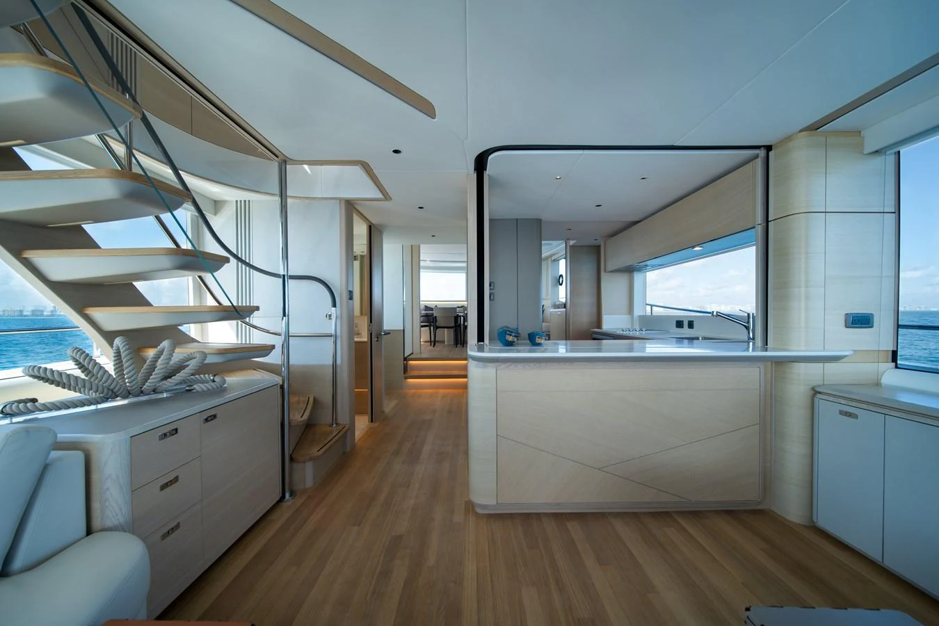 a room with a wood floor and white cabinets aboard MARAVI Yacht for Sale