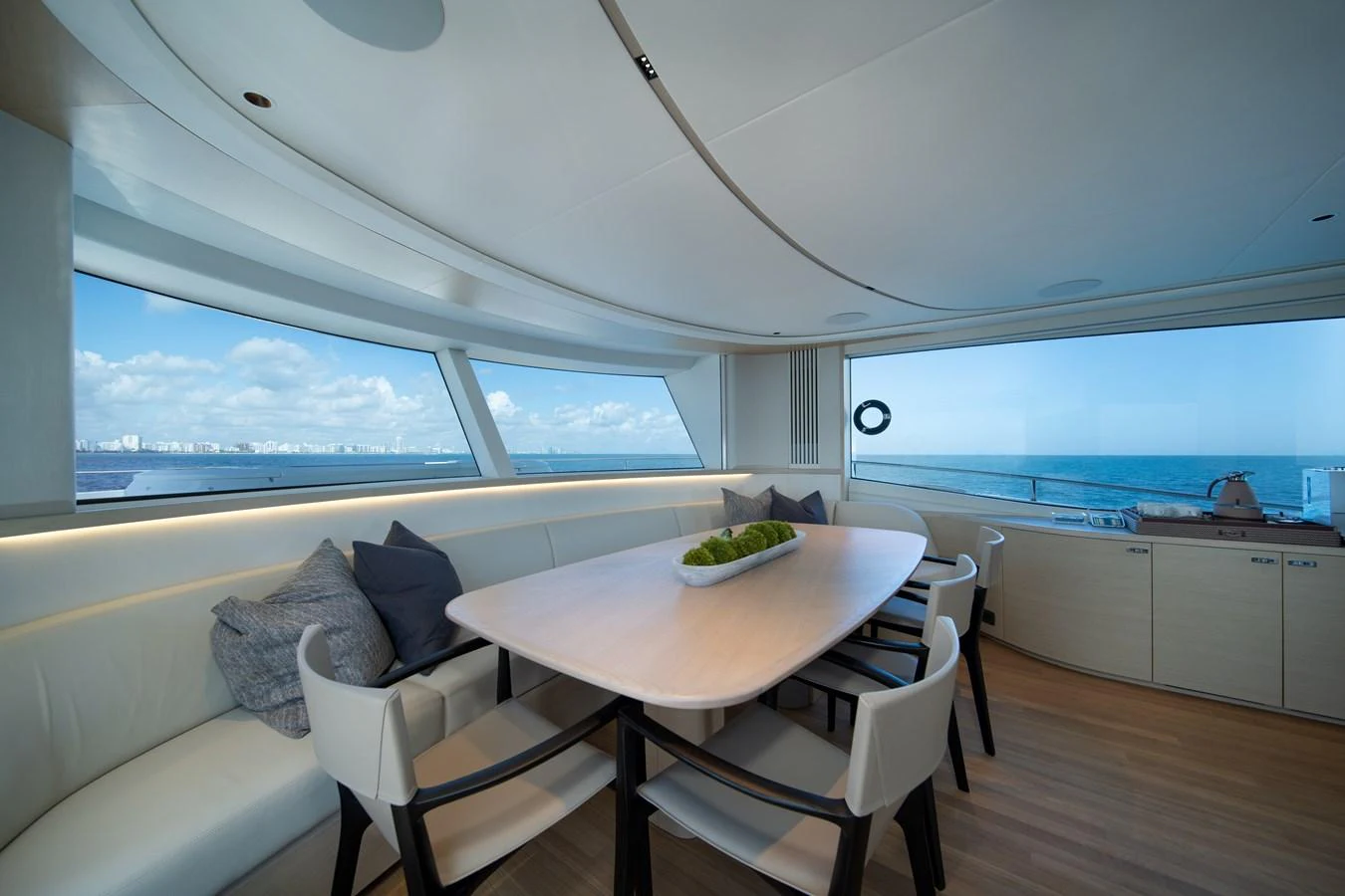 a room with a table and chairs aboard MARAVI Yacht for Sale