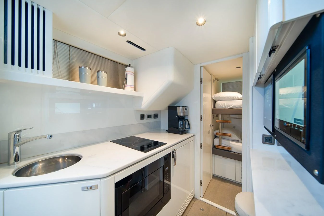 a kitchen with a sink and a mirror aboard MARAVI Yacht for Sale