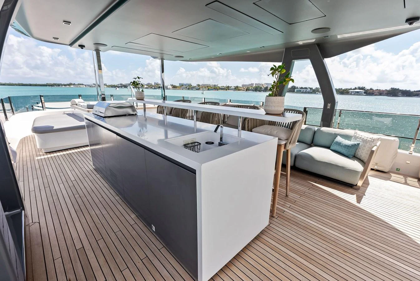 a large white table on a deck aboard LUMPASAURUS Yacht for Sale