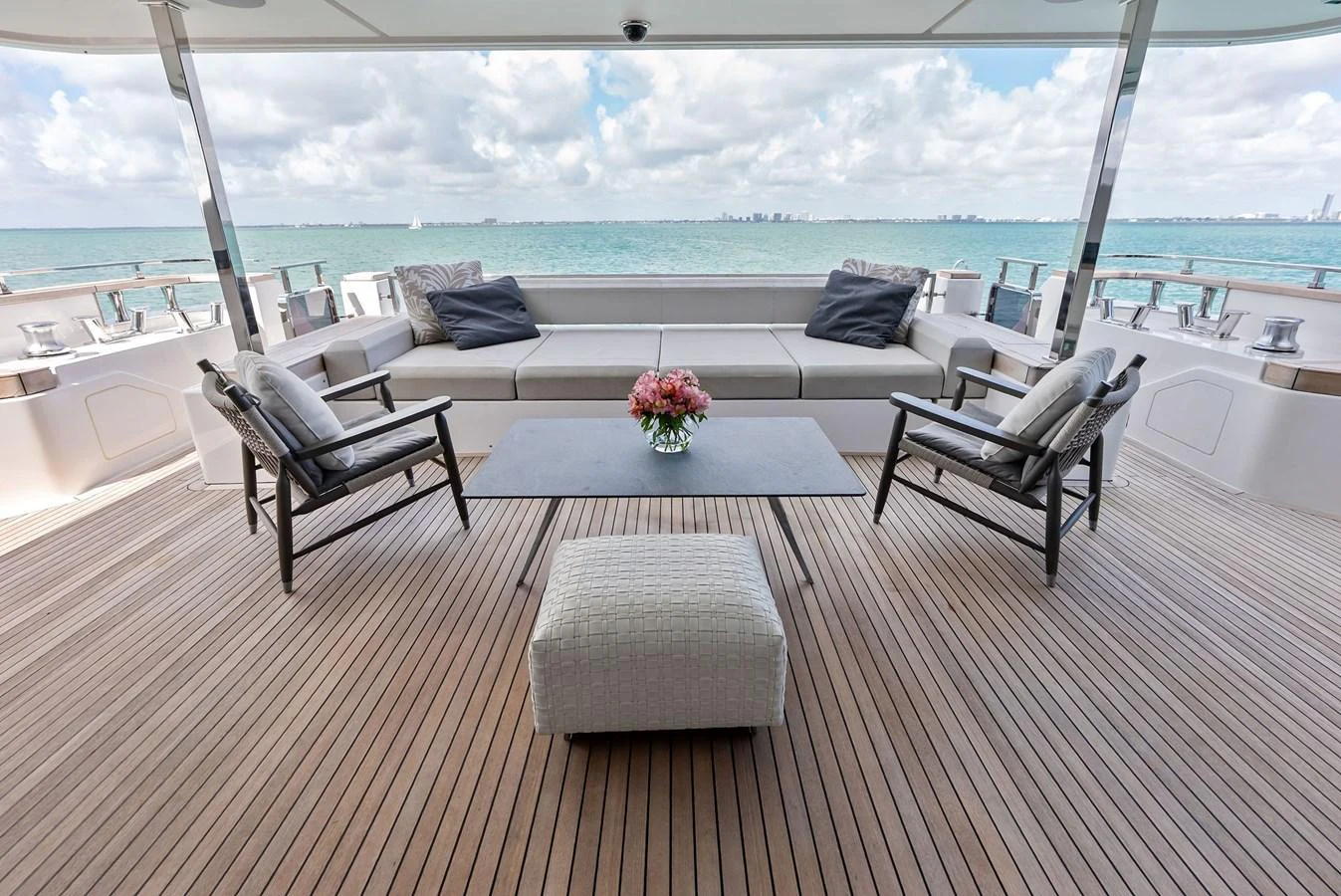 a patio with a table and chairs aboard LUMPASAURUS Yacht for Sale