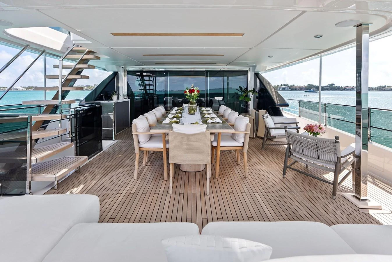 a room with a table and chairs aboard LUMPASAURUS Yacht for Sale