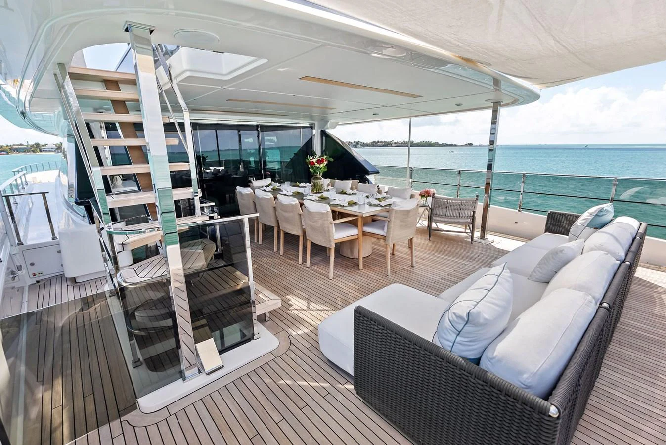 a boat with a table and chairs aboard LUMPASAURUS Yacht for Sale