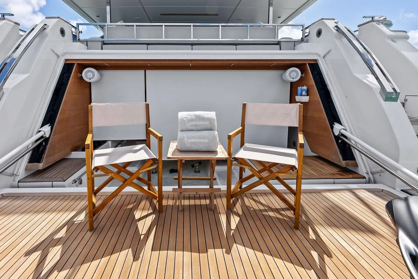 a boat with chairs on a deck aboard LUMPASAURUS Yacht for Sale