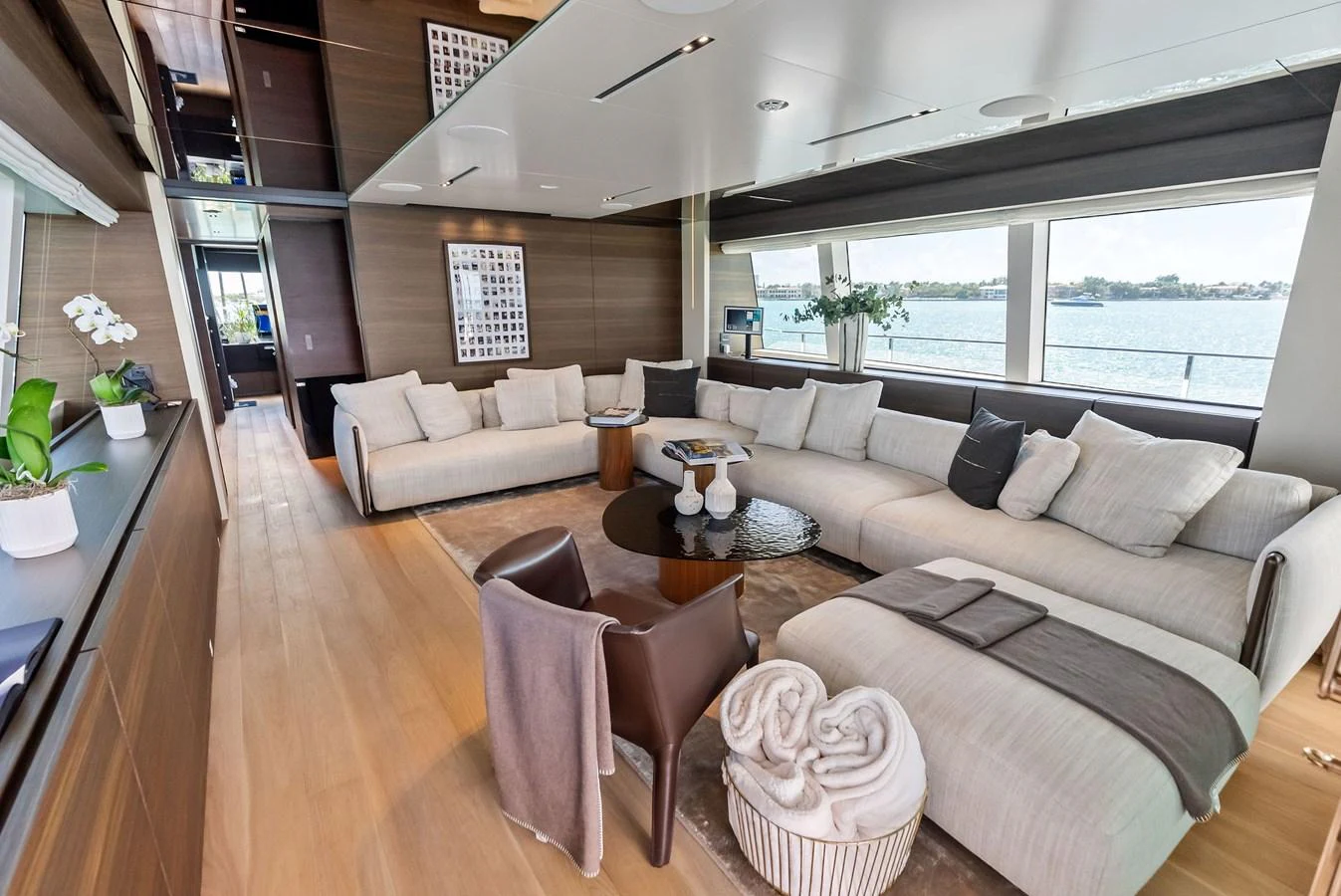 a living room with a large window aboard LUMPASAURUS Yacht for Sale