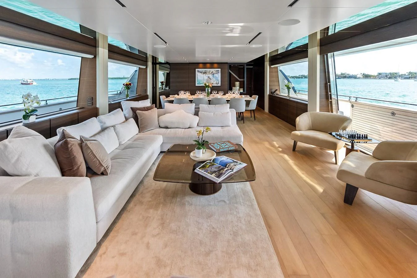 a living room with a large window aboard LUMPASAURUS Yacht for Sale