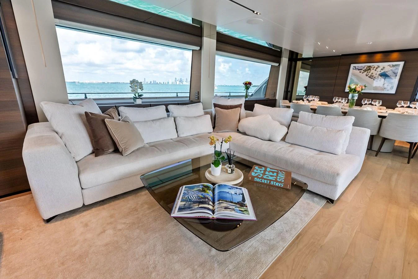 a living room with a large window aboard LUMPASAURUS Yacht for Sale