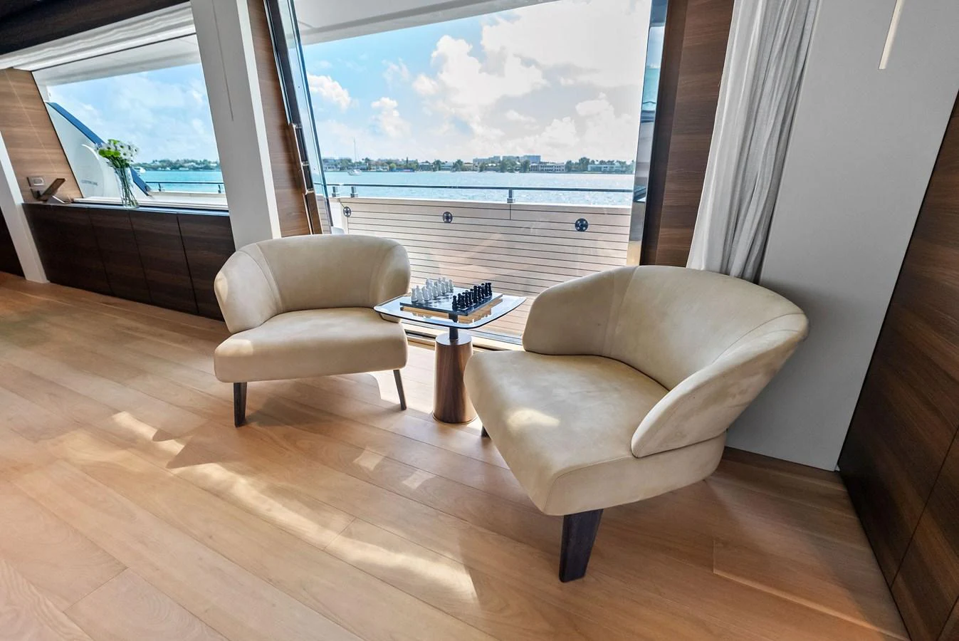 a living room with a large window aboard LUMPASAURUS Yacht for Sale