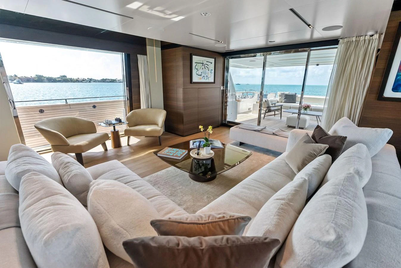a living room with a large window aboard LUMPASAURUS Yacht for Sale