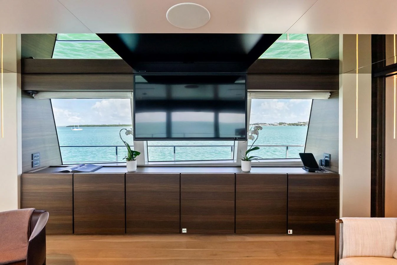 a room with a large window aboard LUMPASAURUS Yacht for Sale