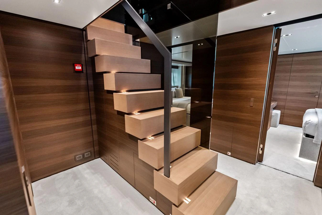 a wood staircase in a room aboard LUMPASAURUS Yacht for Sale