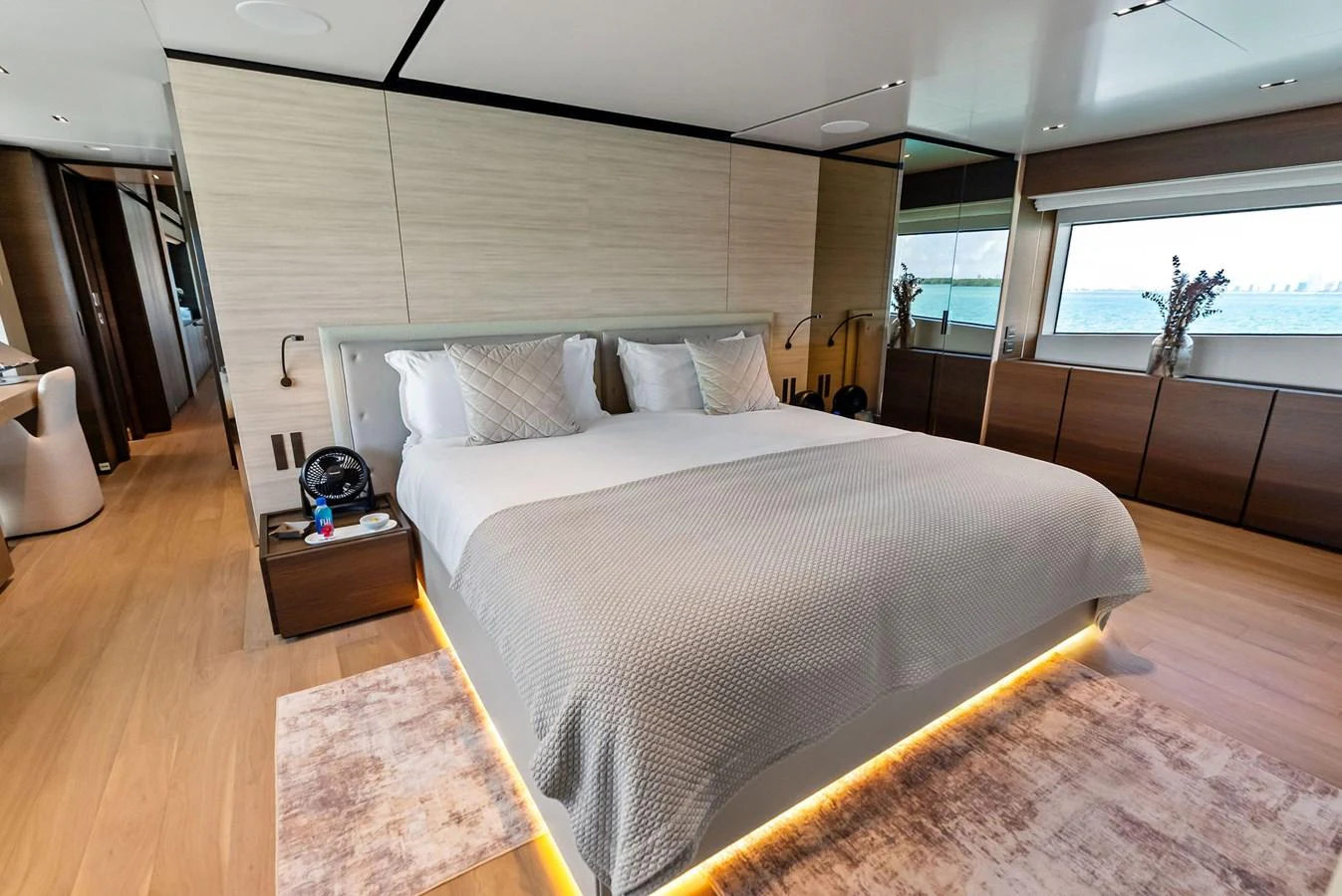 a large bed in a room aboard LUMPASAURUS Yacht for Sale