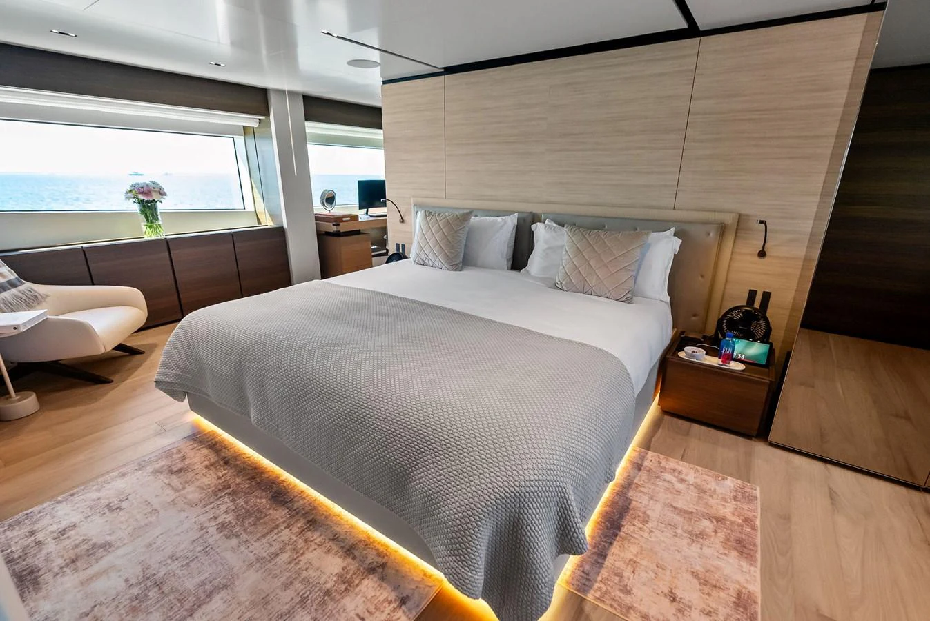 a bedroom with a large bed aboard LUMPASAURUS Yacht for Sale