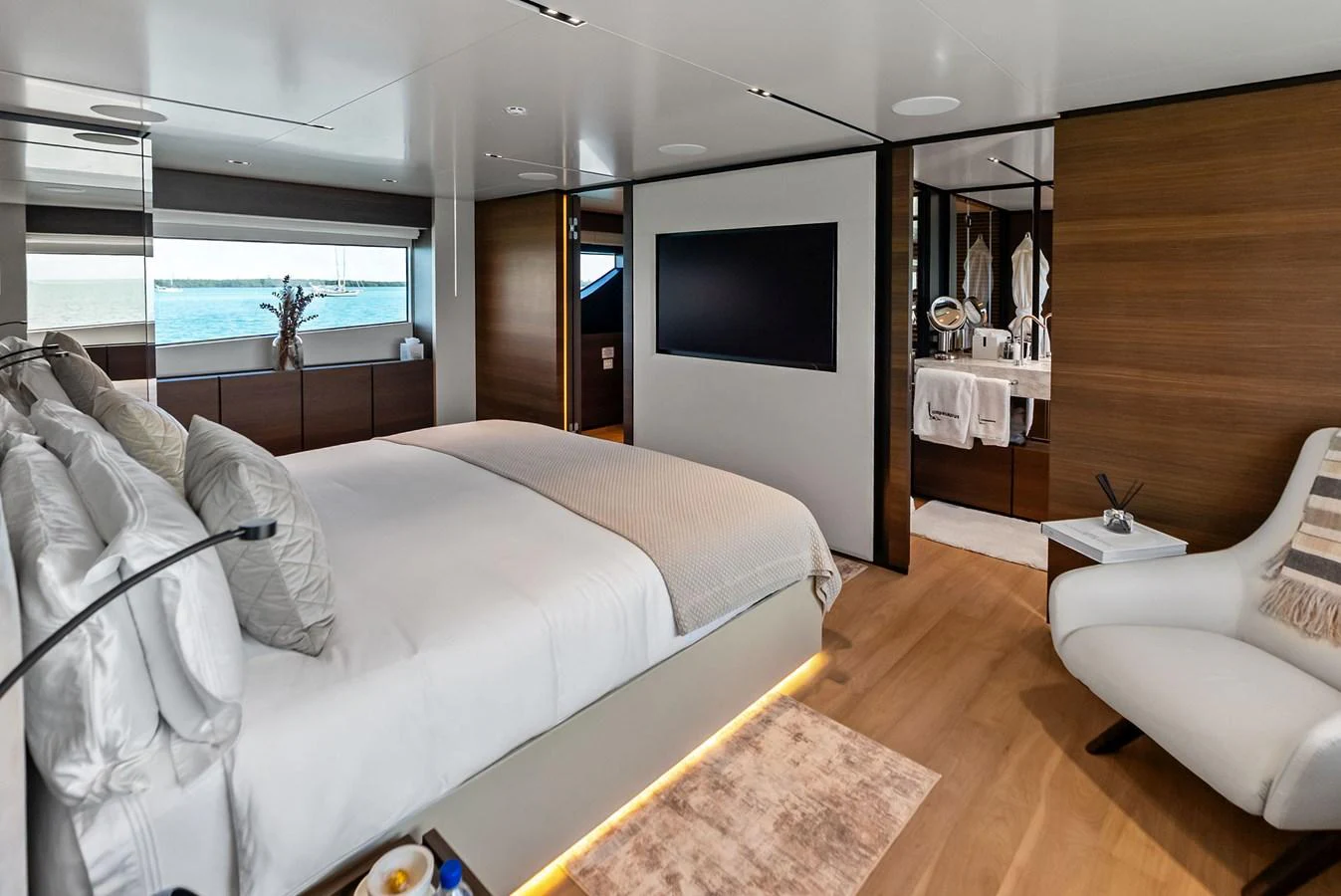 a bedroom with a large bed aboard LUMPASAURUS Yacht for Sale