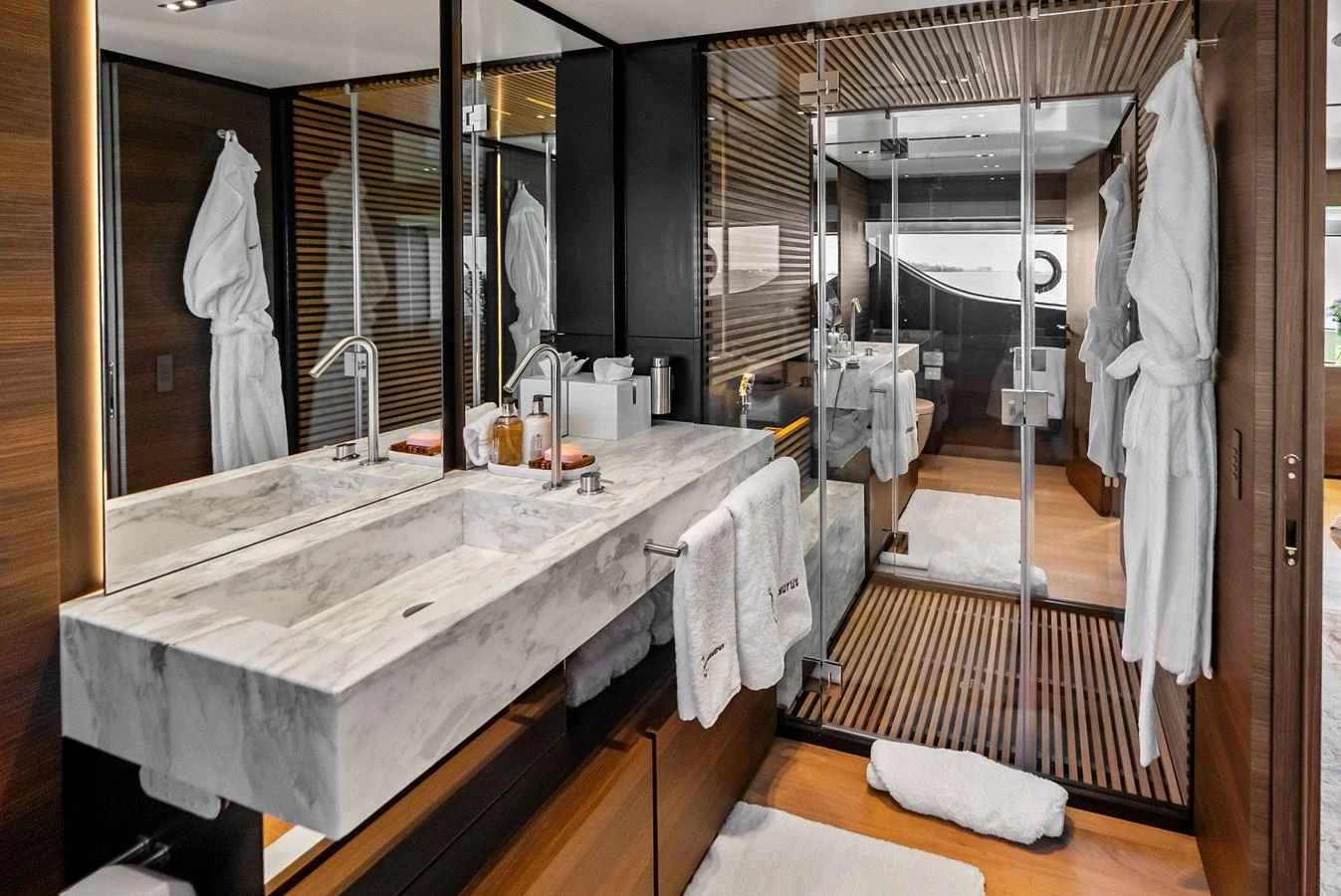 a bathroom with a large mirror aboard LUMPASAURUS Yacht for Sale