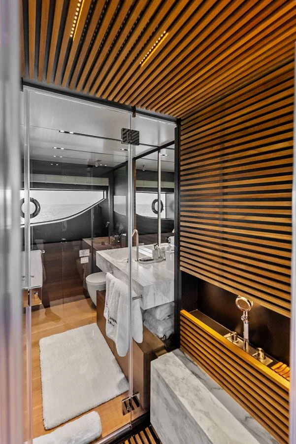 a bathroom with a large mirror aboard LUMPASAURUS Yacht for Sale