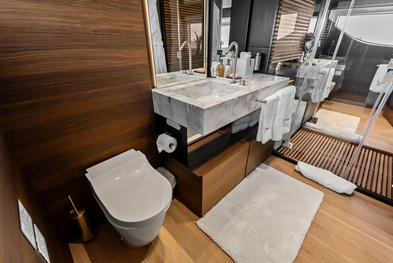 a bathroom with a sink and toilet aboard LUMPASAURUS Yacht for Sale