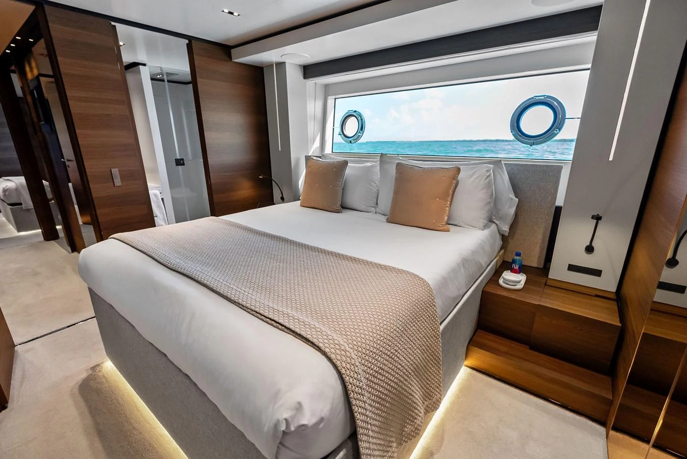 a bed with a white sheet aboard LUMPASAURUS Yacht for Sale