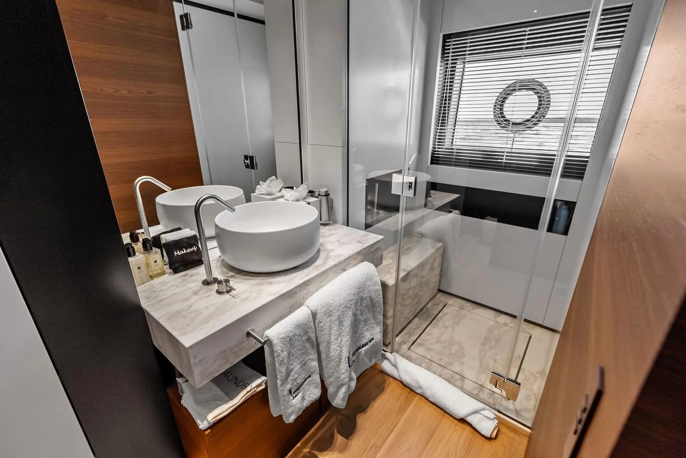 a bathroom with a sink and a bathtub aboard LUMPASAURUS Yacht for Sale