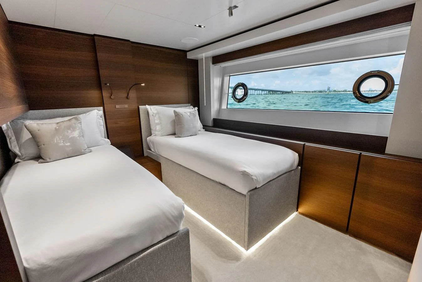 a room with a bed and a window aboard LUMPASAURUS Yacht for Sale