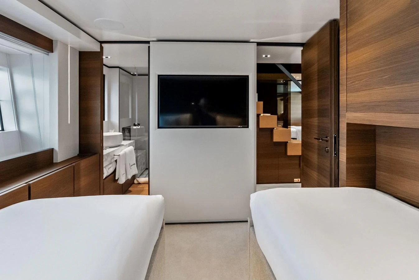 a room with a bed and a television aboard LUMPASAURUS Yacht for Sale