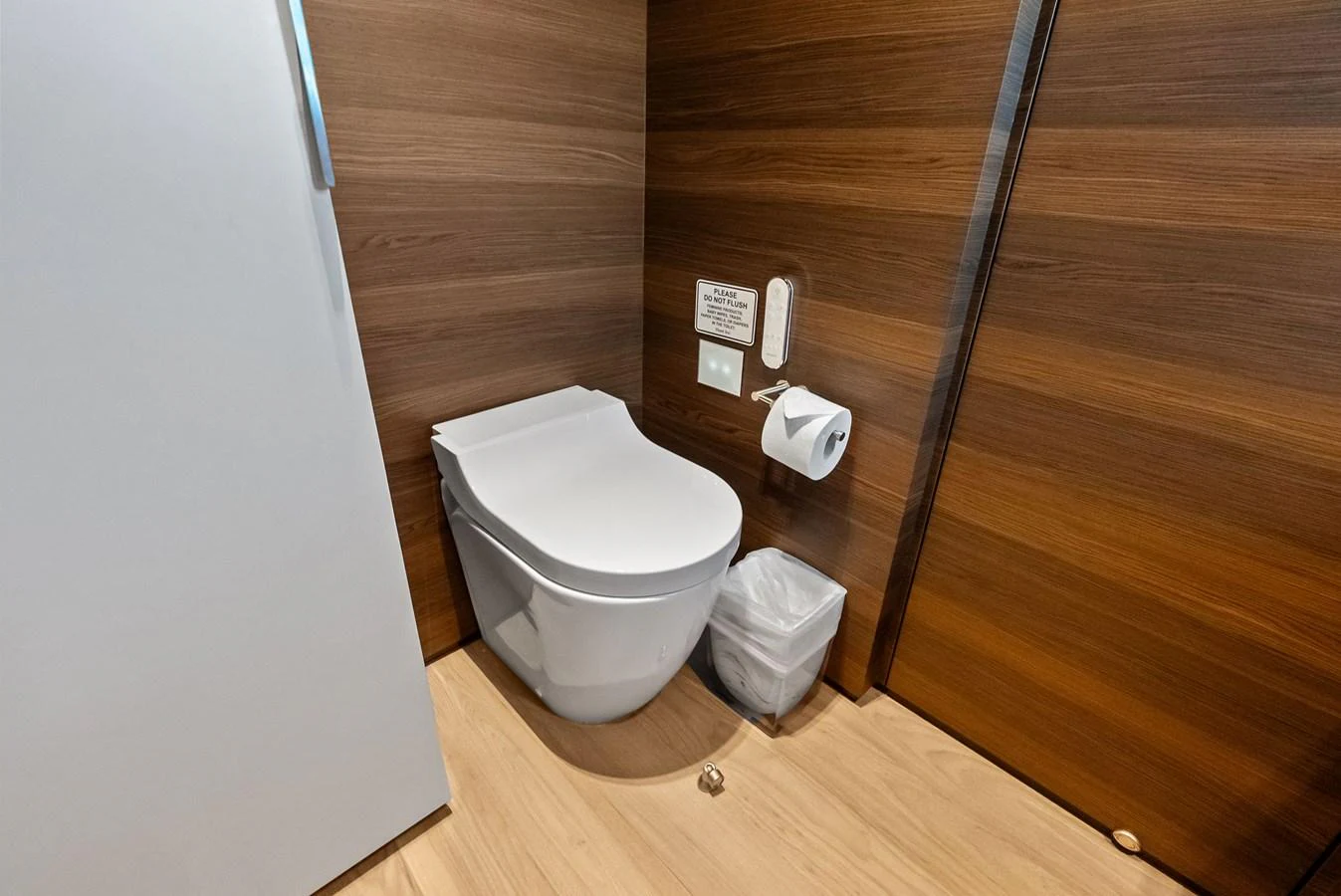 a toilet in a bathroom aboard LUMPASAURUS Yacht for Sale
