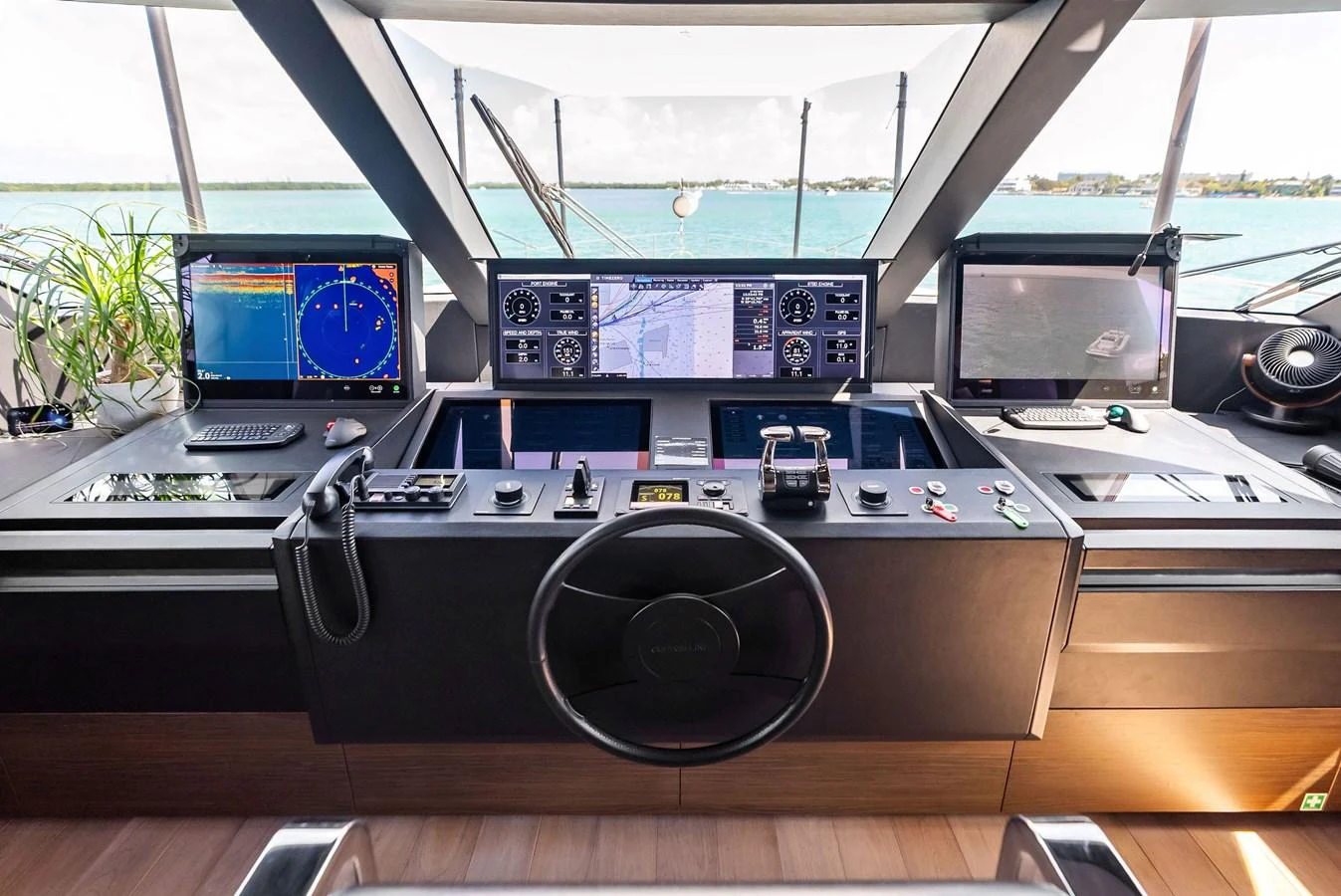 a large electronic device with a round display on the side aboard LUMPASAURUS Yacht for Sale