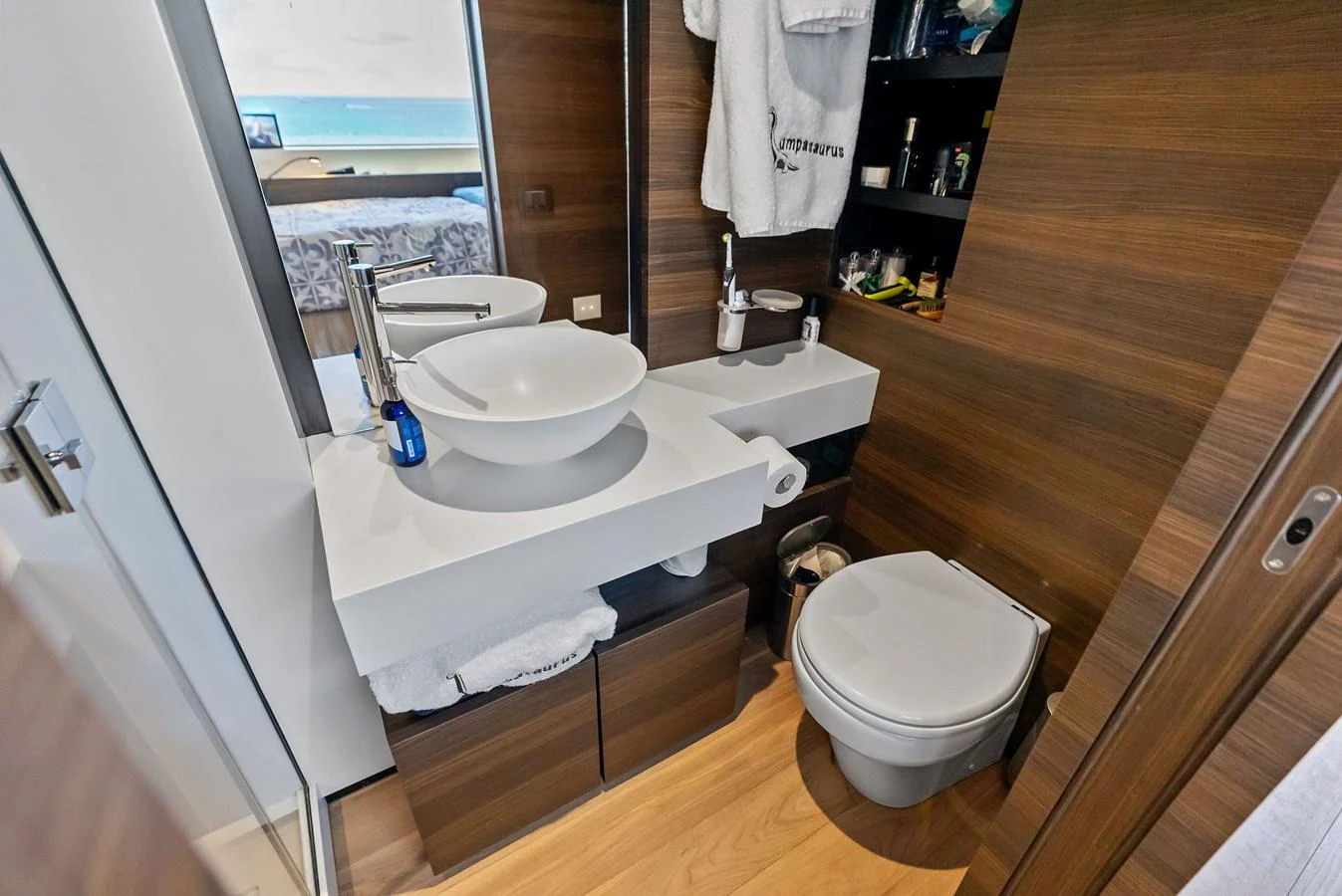 a bathroom with a sink and toilet aboard LUMPASAURUS Yacht for Sale