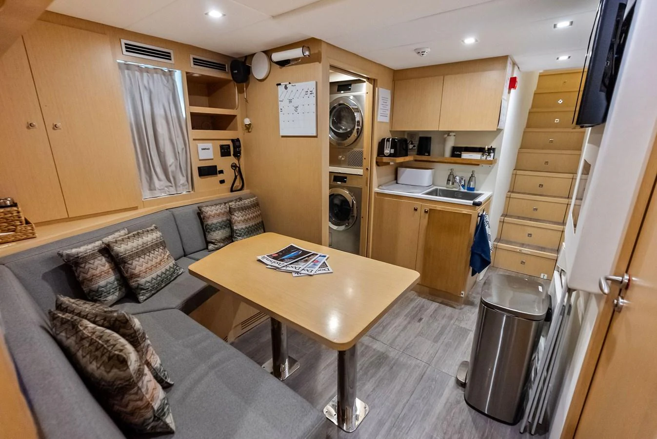 a kitchen and living room aboard LUMPASAURUS Yacht for Sale