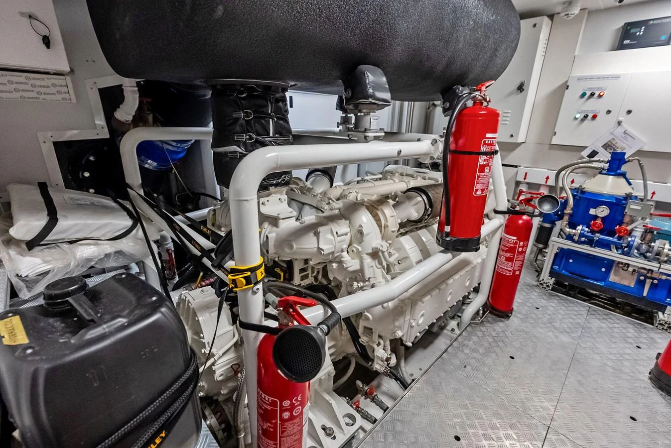 a close-up of a car engine aboard LUMPASAURUS Yacht for Sale
