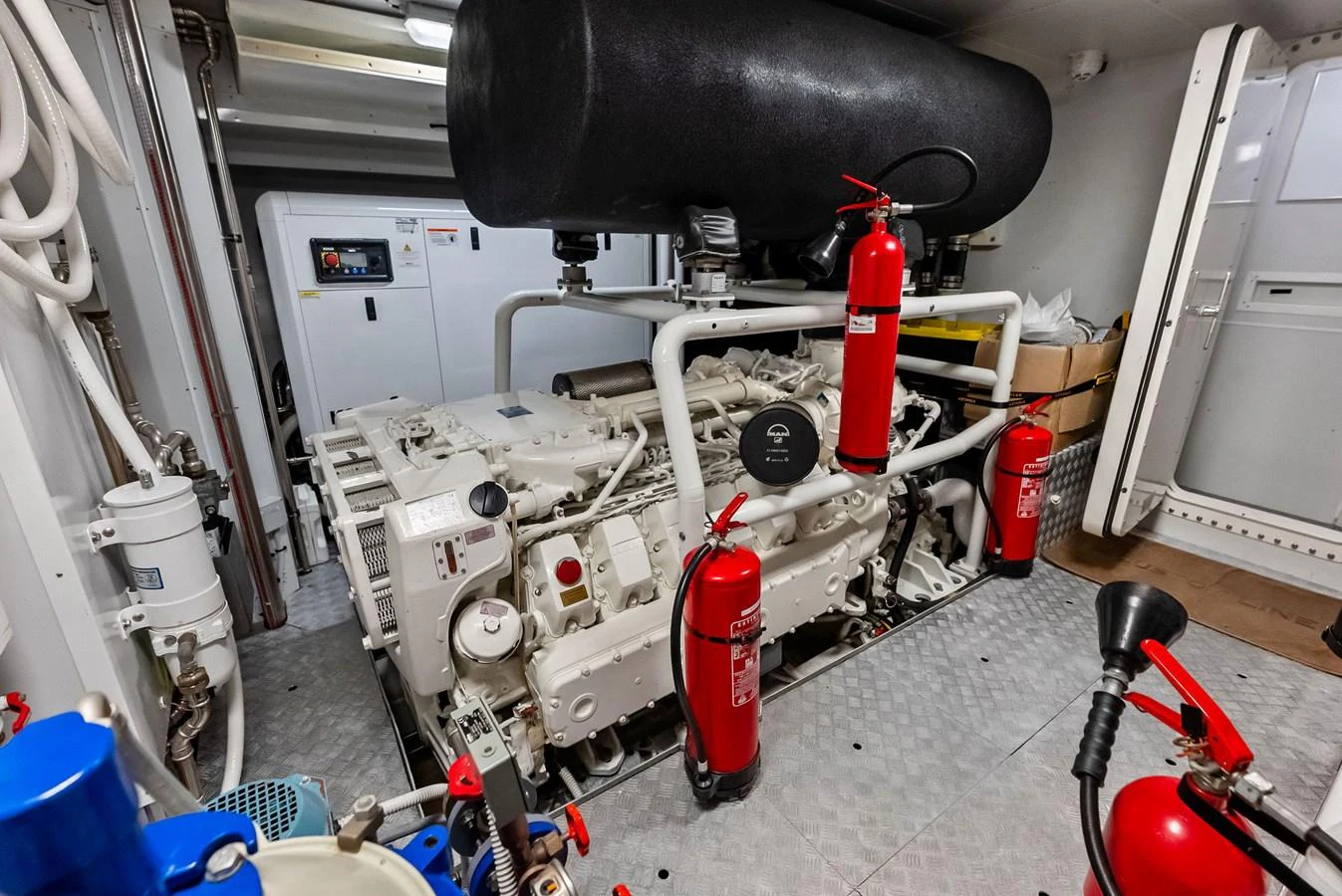 a machine with a large black cylinder aboard LUMPASAURUS Yacht for Sale