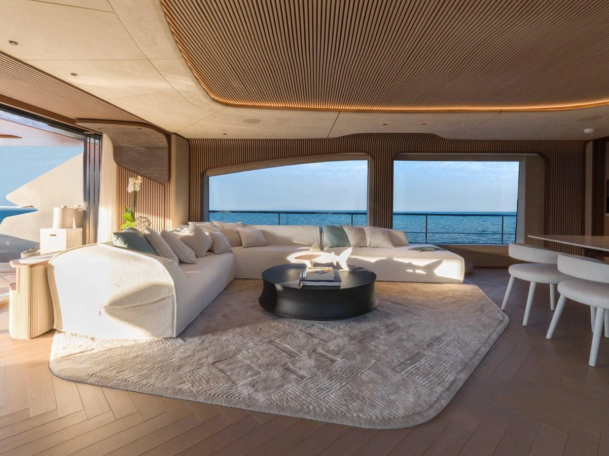 The salon offers a spacious and elegant seating area with panoramic ocean views. aboard PESA II Yacht for Sale