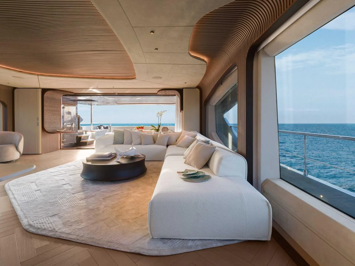 The salon offers a luxurious and spacious seating area with panoramic ocean views. aboard PESA II Yacht for Sale