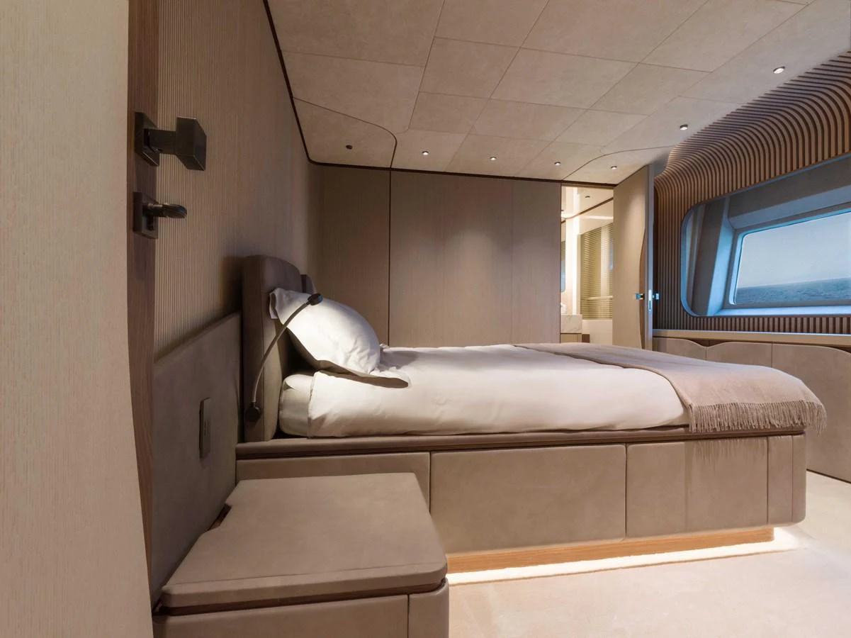 The stateroom features a modern design with a comfortable bed and ample storage. aboard PESA II Yacht for Sale