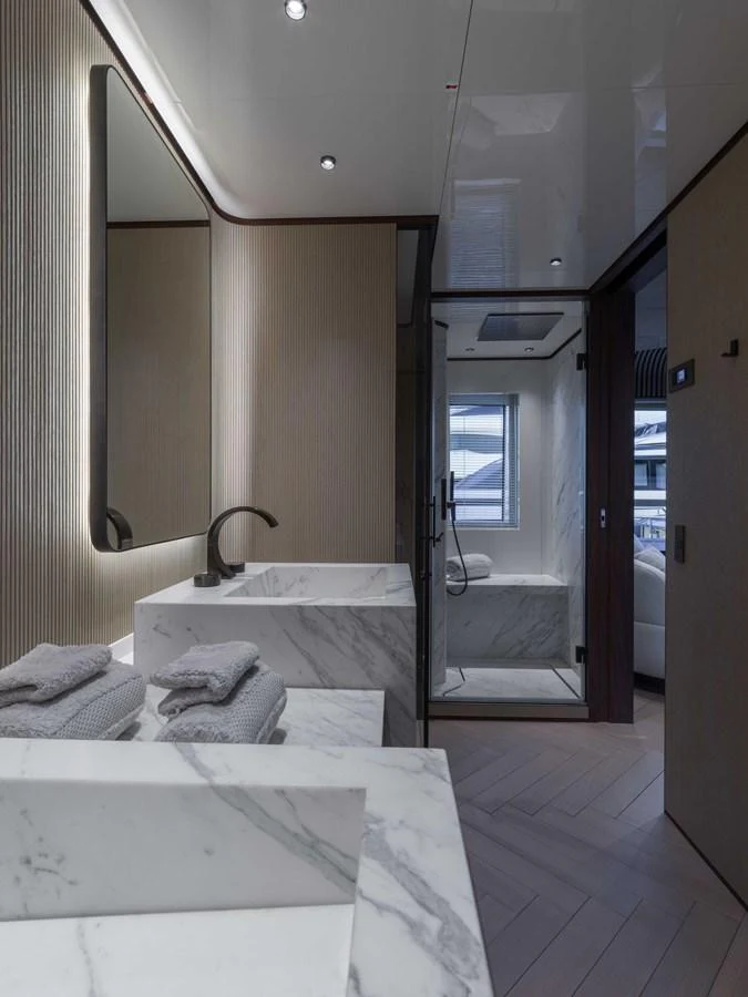 The yacht's bathroom features elegant marble countertops and modern fixtures. aboard PESA II Yacht for Sale