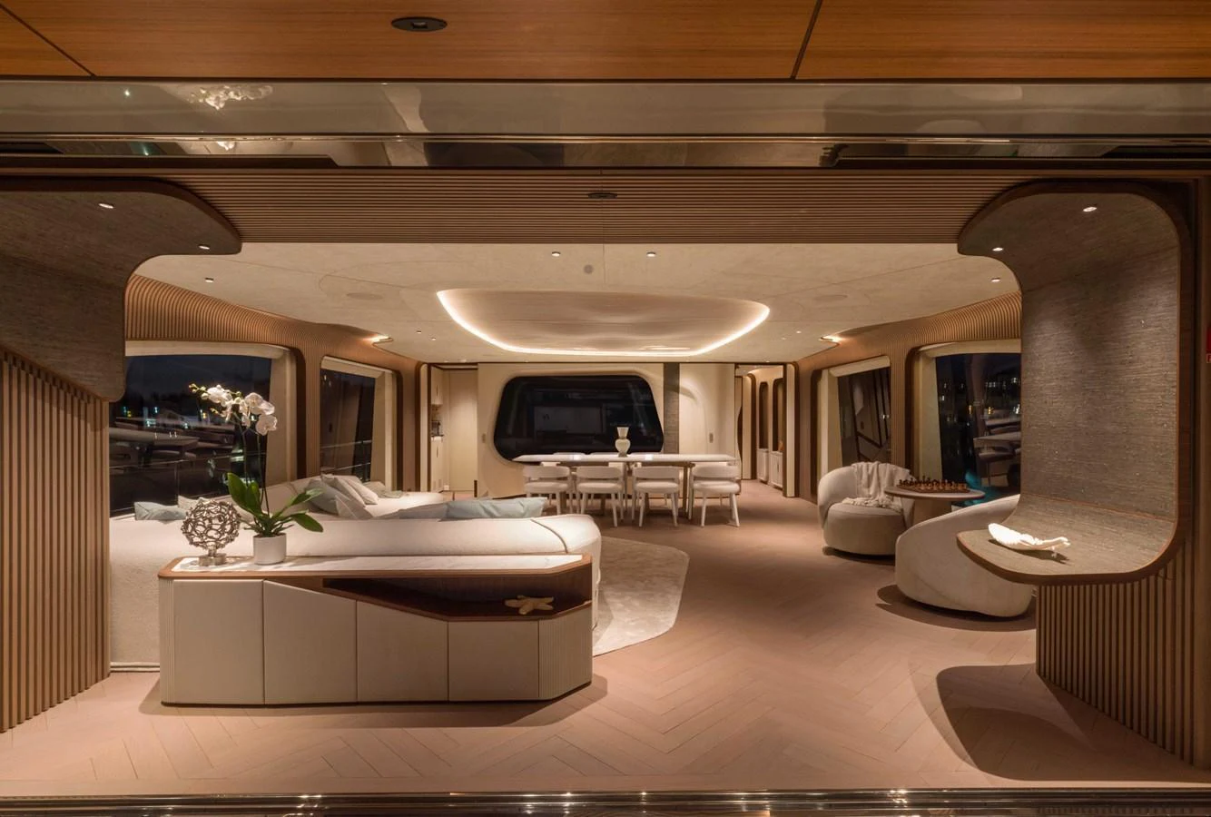 The yacht's salon exudes elegance with its modern furnishings and ambient lighting. aboard PESA II Yacht for Sale