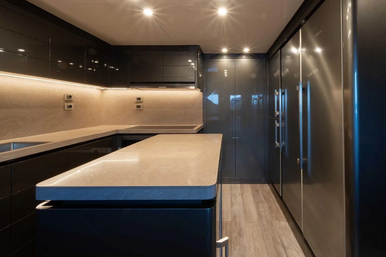 The galley features sleek, modern cabinetry and high-end appliances, creating a sophisticated culinary space. aboard PESA II Yacht for Sale
