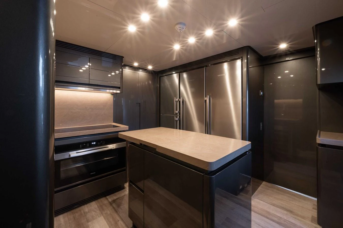 The yacht's galley features modern appliances and sleek cabinetry, creating a sophisticated culinary space. aboard PESA II Yacht for Sale