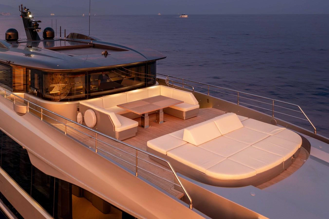 The yacht's sundeck offers a luxurious space for relaxation with ample seating and stunning ocean views. aboard PESA II Yacht for Sale
