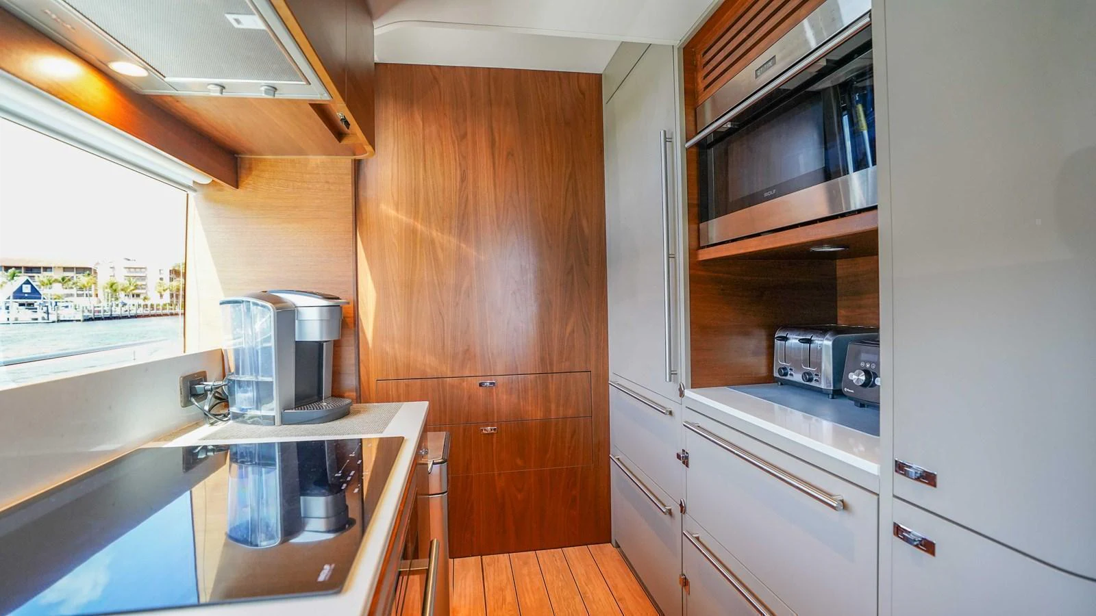The yacht's galley is equipped with modern appliances and sleek cabinetry. aboard RECORD YEAR Yacht for Sale