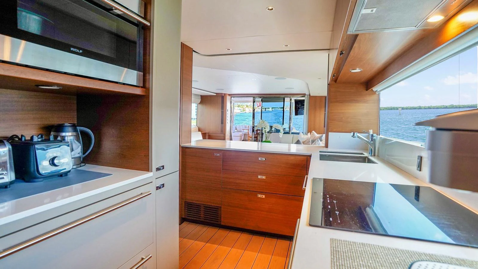 The yacht's galley features modern appliances and a sleek design with ample natural light. aboard RECORD YEAR Yacht for Sale