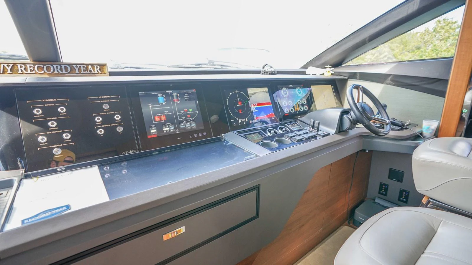 The helm station features advanced navigation and control systems for a seamless sailing experience. aboard RECORD YEAR Yacht for Sale