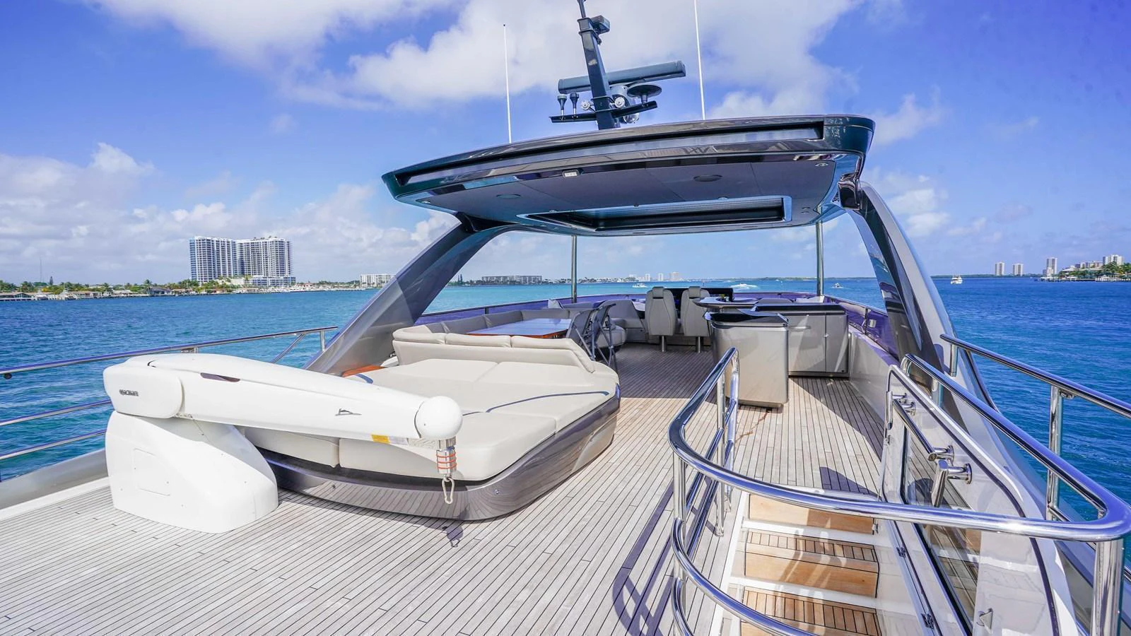 The flybridge offers a spacious and luxurious area for relaxation and entertainment with stunning views of the water. aboard RECORD YEAR Yacht for Sale