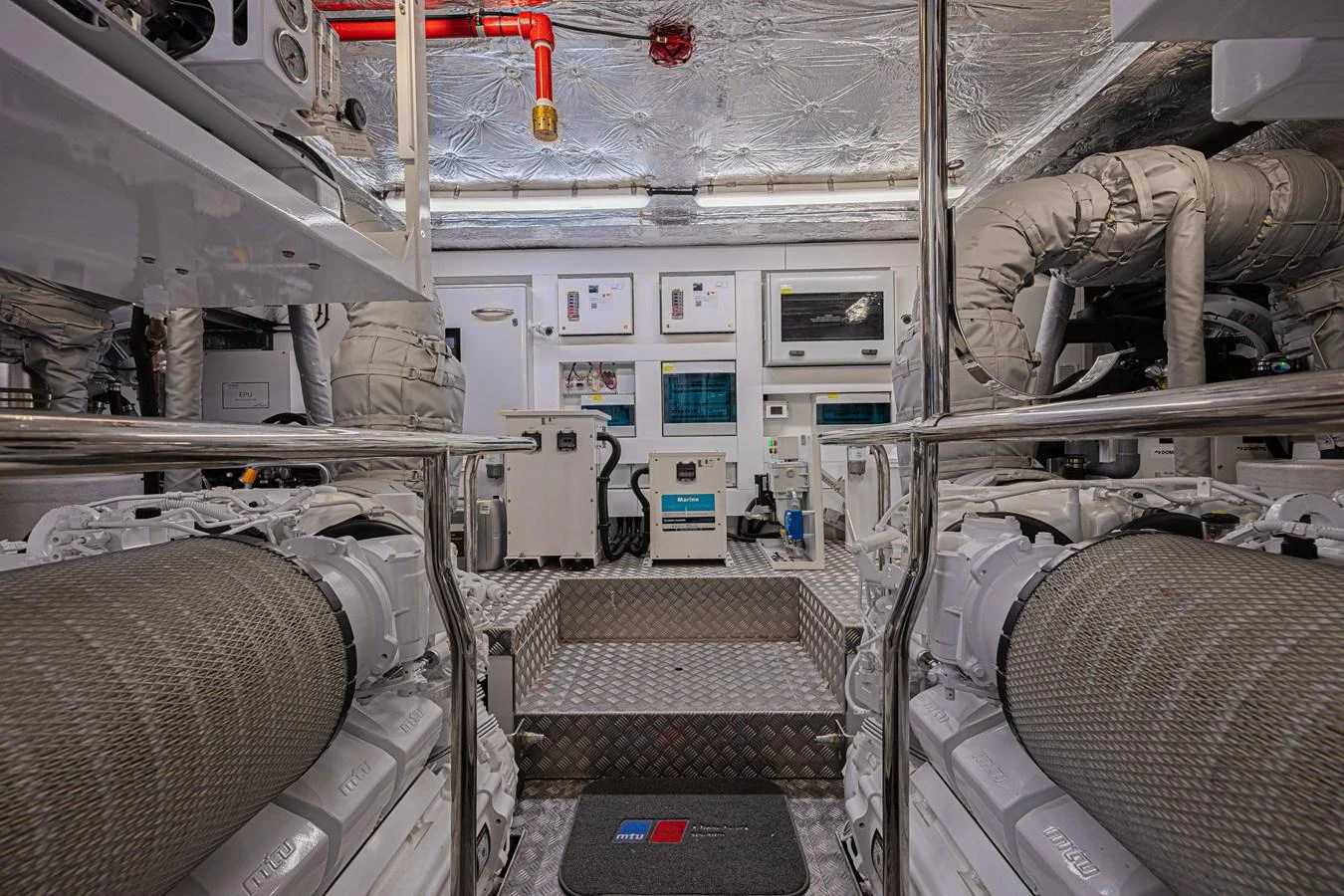 The image showcases a well-organized engine room with advanced machinery and equipment. aboard HIDEOUT Yacht for Sale