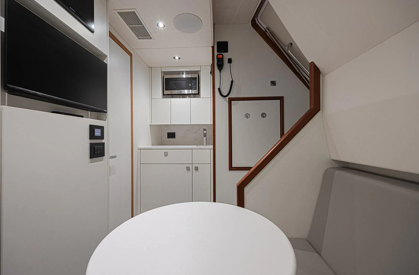 The yacht's galley features modern appliances and a clean, minimalist design. aboard HIDEOUT Yacht for Sale