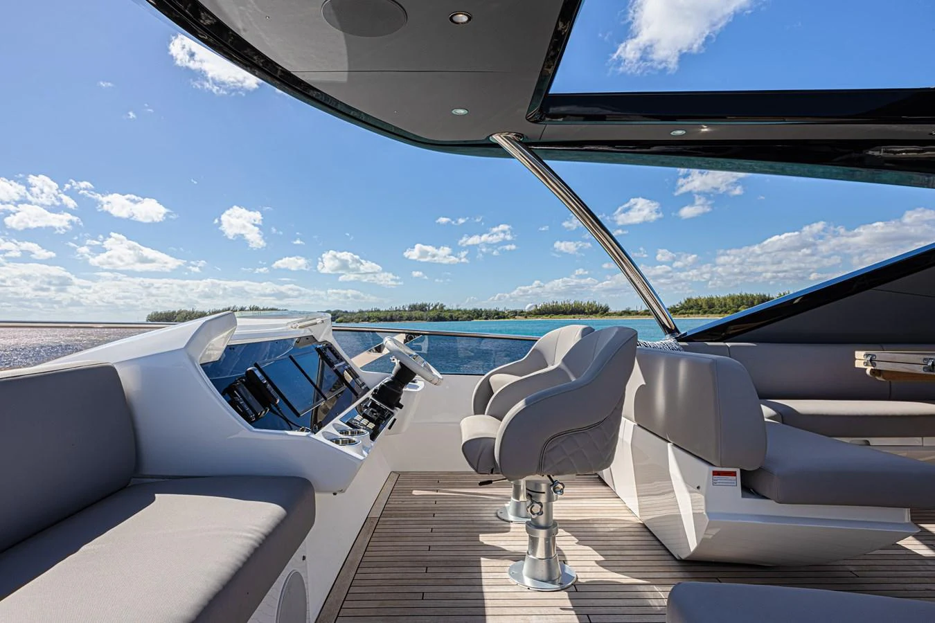 The helm area offers a sleek and modern design with comfortable seating and advanced navigation equipment. aboard HIDEOUT Yacht for Sale