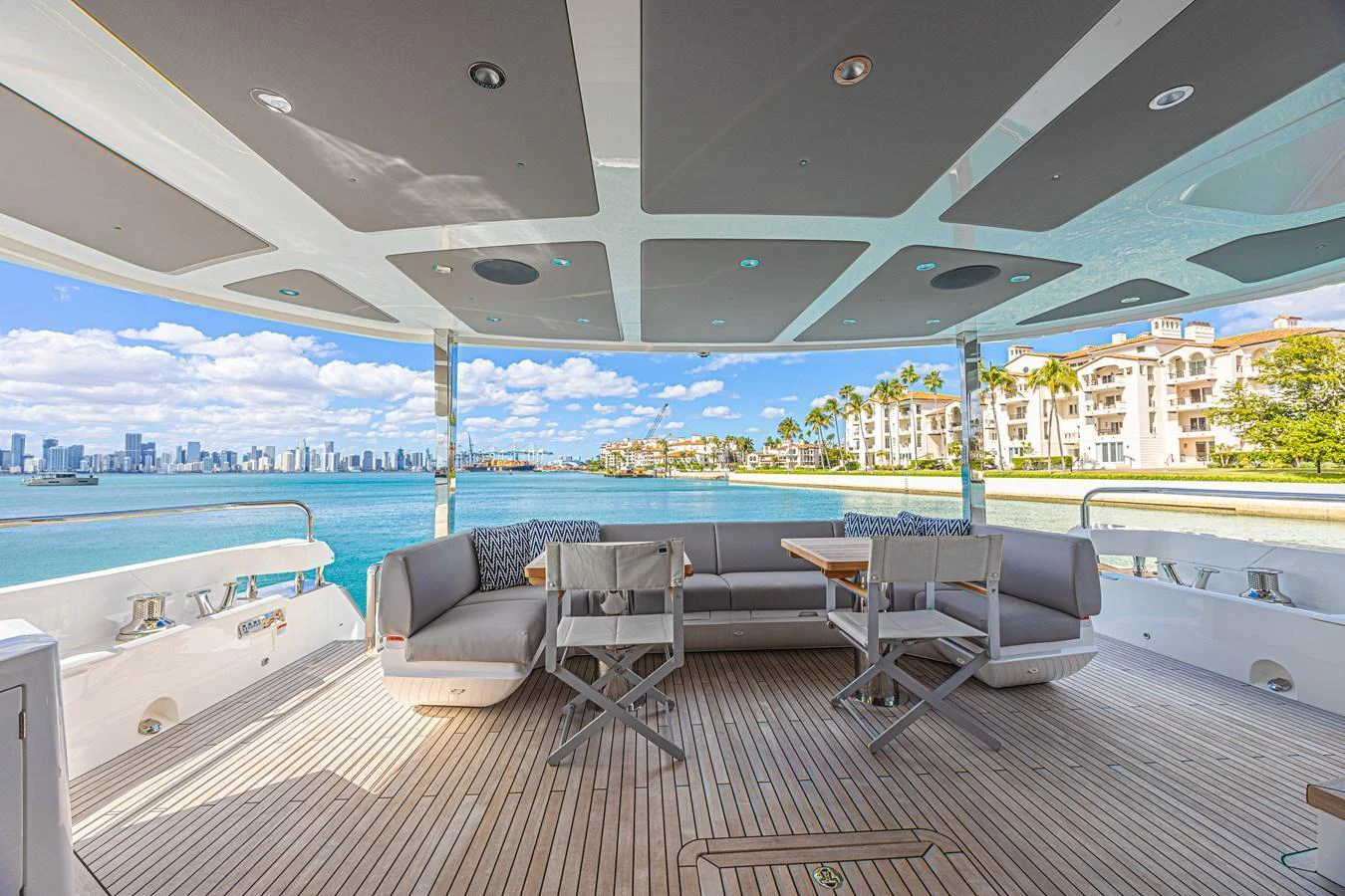 The aft deck offers a spacious and inviting area for relaxation and dining with stunning waterfront views. aboard HIDEOUT Yacht for Sale