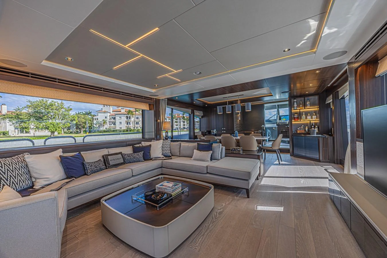 The salon features a spacious and modern design with ample seating and elegant lighting. aboard HIDEOUT Yacht for Sale